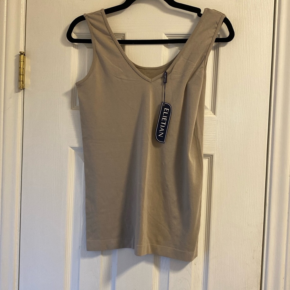 Elietian looks a lot like love reversible tank in sand. V-neck or scoop neck.
